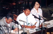 意見を述べる岡村精二